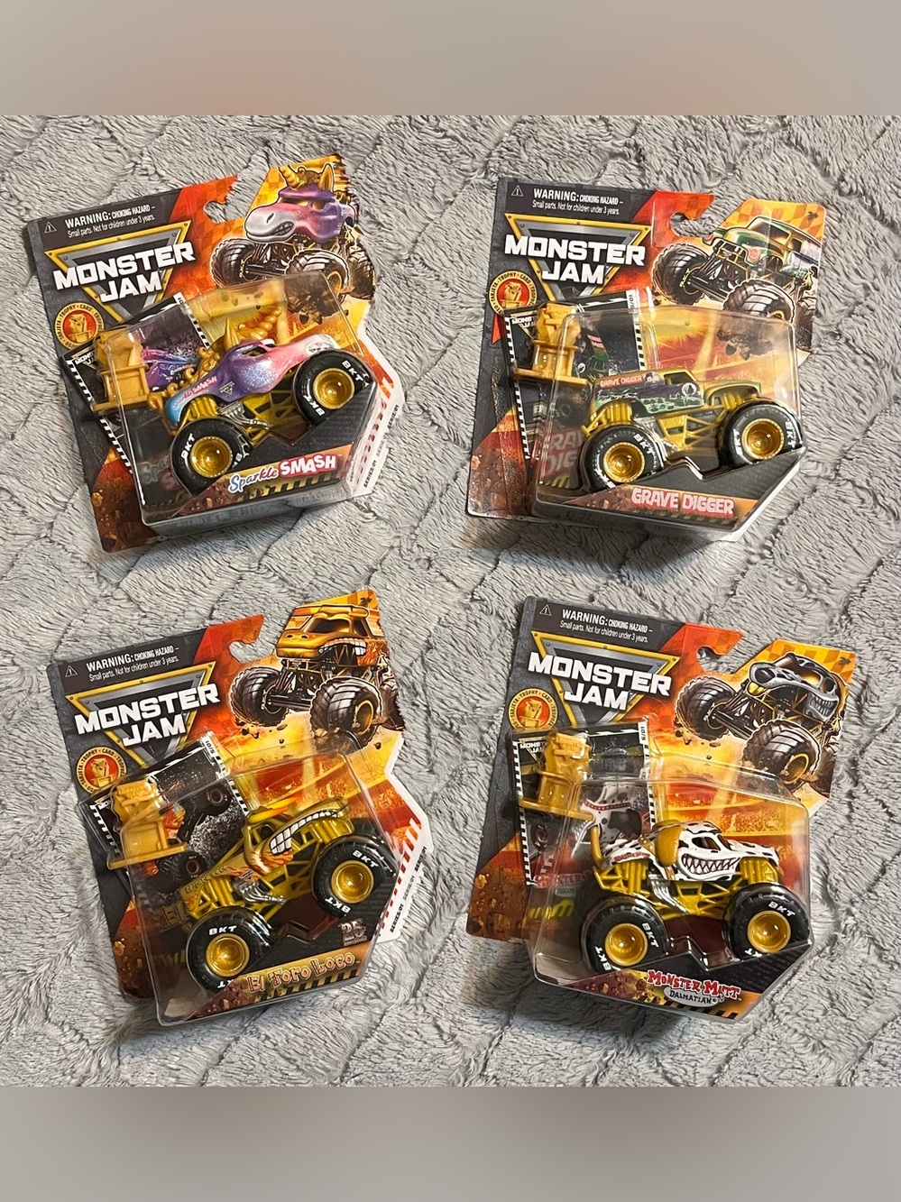 Monster Jam Gold Trophy Series 1 - Complete Set of 4 (1:64 Scale)